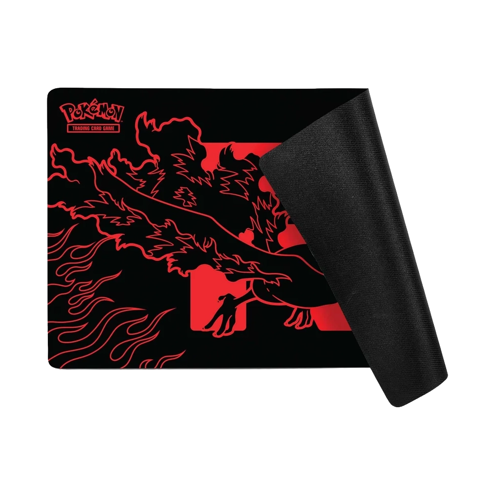 A black Pokémon Trading Card Game playmat with a Moltres graphic and a curled-up black underside, shown on a plain white background.